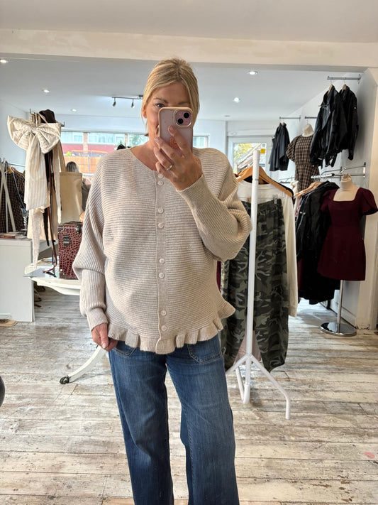 HALLE RIBBED FRILL HEM CARDIGAN IN BEIGE